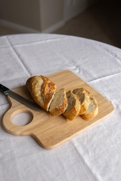 Rustic charm captured in sliced French bread on a wooden board A simple yet inviting scene showcas