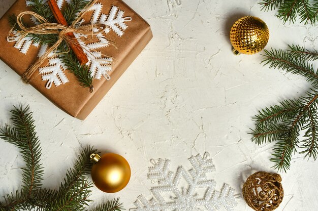 Rustic christmas gift box with christmas decorations on white background flatlay copy space