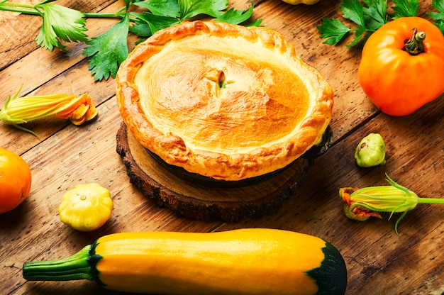 Rustic closed vegetable pie. Pie with zucchini and squash.