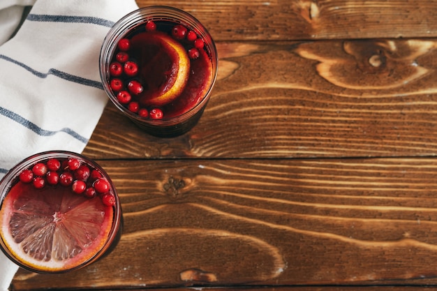 Rustic composition with glint wine and ingredients on old wooden table