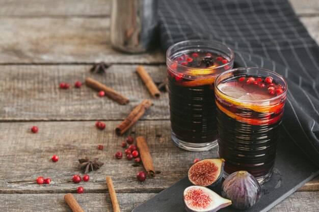 Rustic composition with glint wine and ingredients on old wooden table