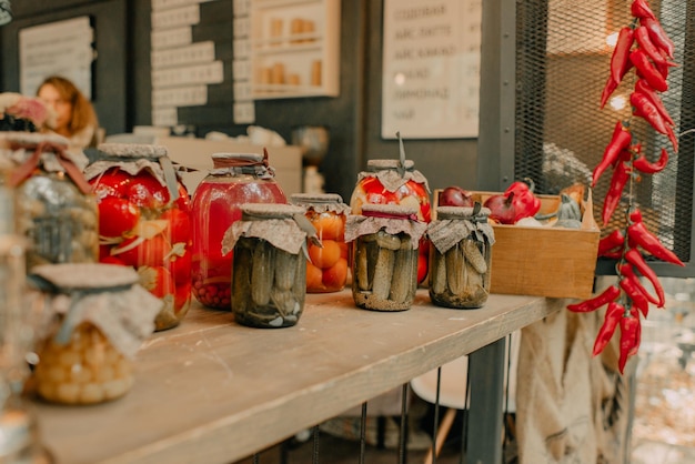 A rustic courtyard decorated in the style of a loft with a lot of canned vegetables