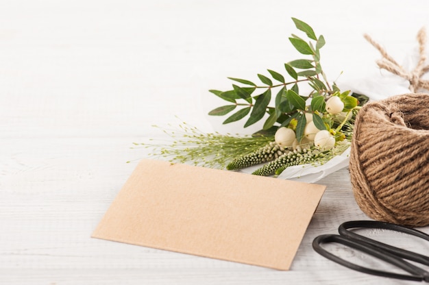 Rustic craft envelope with wild flower