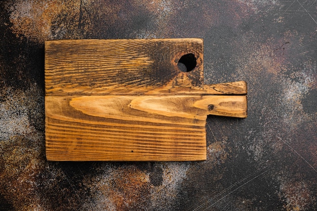 Rustic cutting board set, top view flat lay , with copy space for text or food, on old dark rustic table background