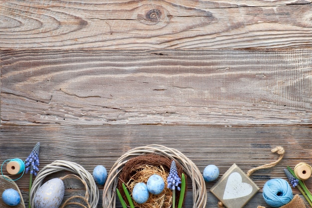 Rustic Easter background with eggs, blue hyacinth flowers and  wooden heart