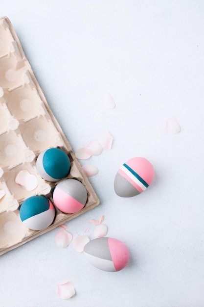 Rustic Easter Eggs. Still life of beautiful painted Easter eggs on white table. Concept for individuality, being different, organic, tattoo on egg.