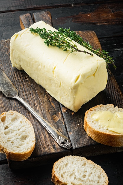 Rustic farmhouse inspired fresh butter, on old dark  wooden table background