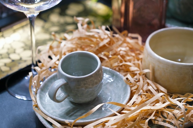 Rustic handmade blue ceramic bowls dish and mug on blue table