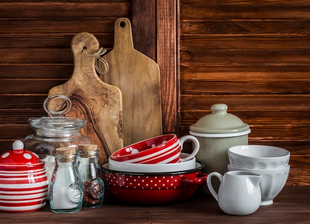 Rustic kitchen still life Olive cutting board jar of flour bowls pan enamelled jar gravy boat