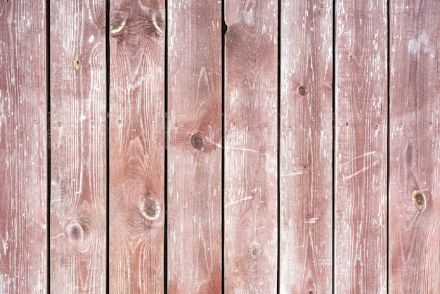 Rustic plank fence brown old bark wood textured photo.