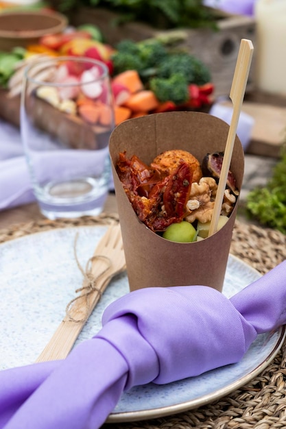 Rustic style place setting and food for a woodland naming ceremony