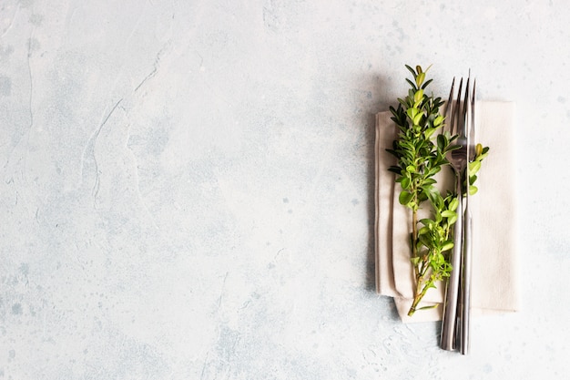 Rustic table setting with boxwood with copy space. Holidays decoration on Provence style. 