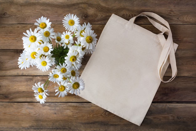 Rustic tote bag mockup with daisy