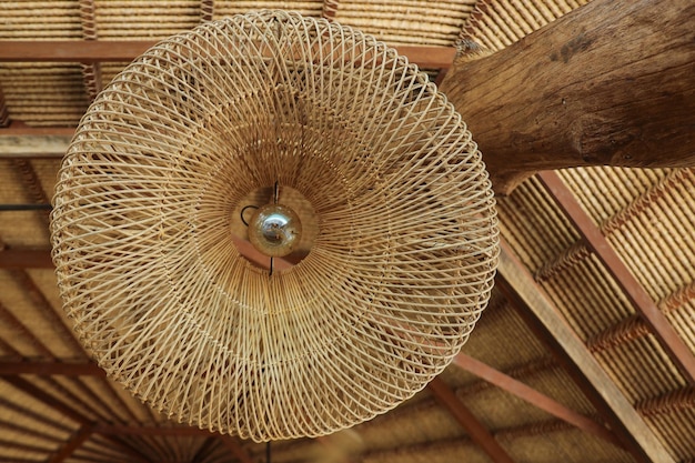 Rustic and vintage traditional rattan lamp at old roof