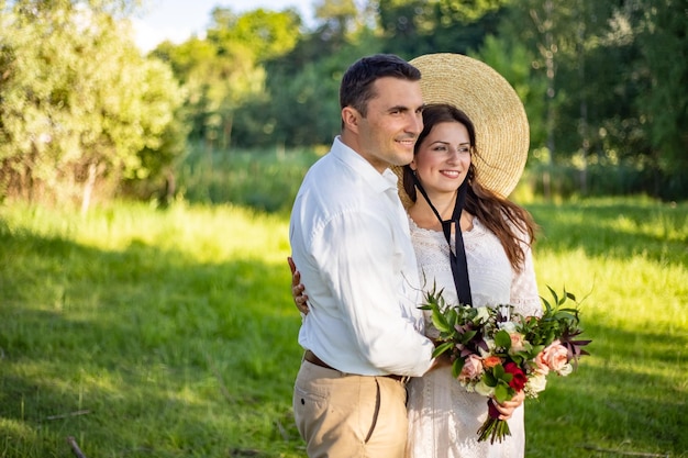 Rustic wedding bride and groom stand side by side