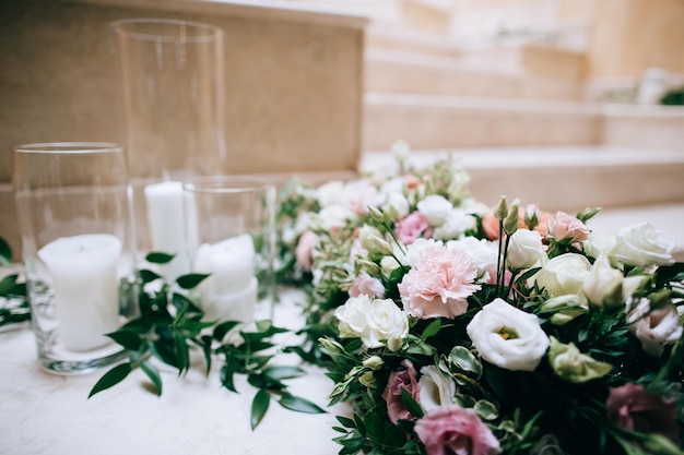 Rustic wedding decor decorated stairs white candles and fresh flowers