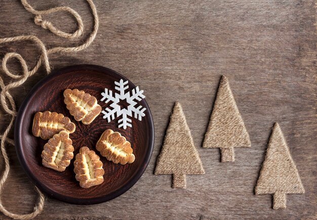 Rustic winter composition with shortbread cookies on a plate