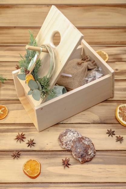 Rustic wooden gift box with ceramic mug on wooden planks