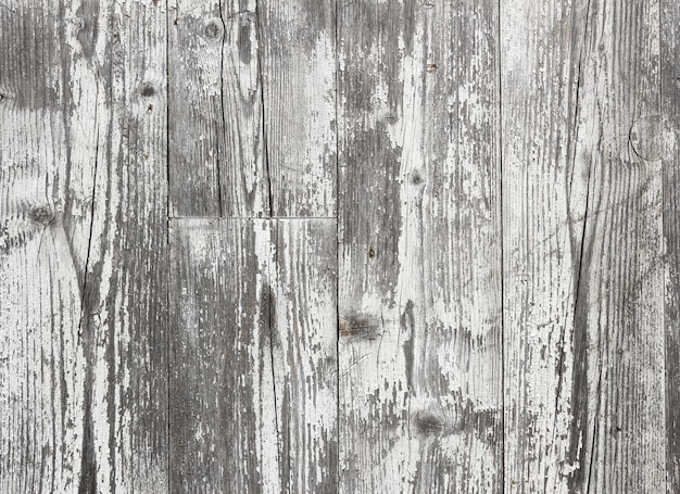 Photo rustic wooden planks background with peeling white paint