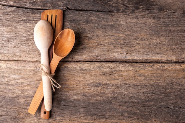 Rustic wooden spoons on a old wooden table