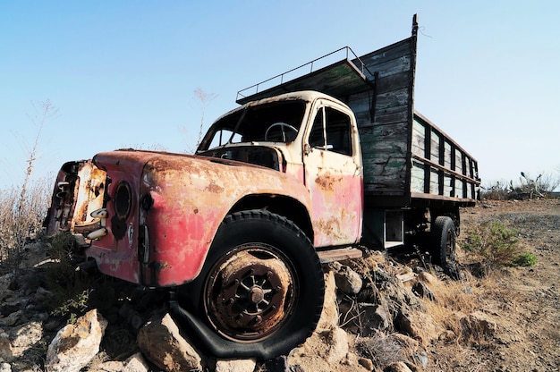 rusty abandoned truck on the desert, in canary islands, spain