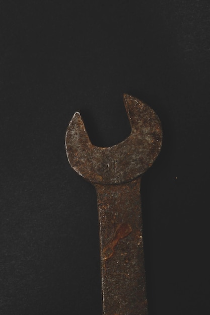 A rusty auto wrench on white background