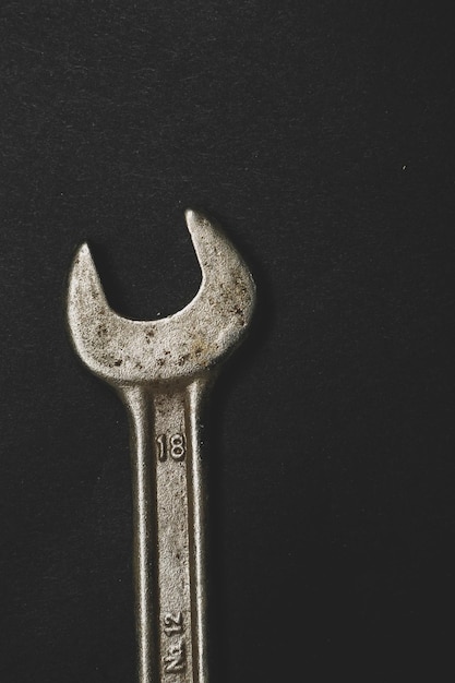 A rusty auto wrench on white background