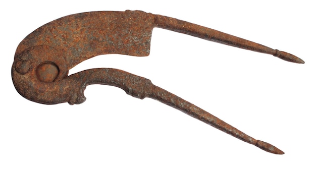 Rusty betel nut cutter over white background