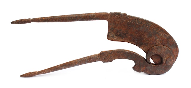 Rusty betel nut cutter over white background