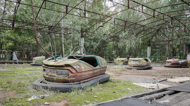 Rusty and deserted autodrome with foliage growing through it Pripyat Ukraine