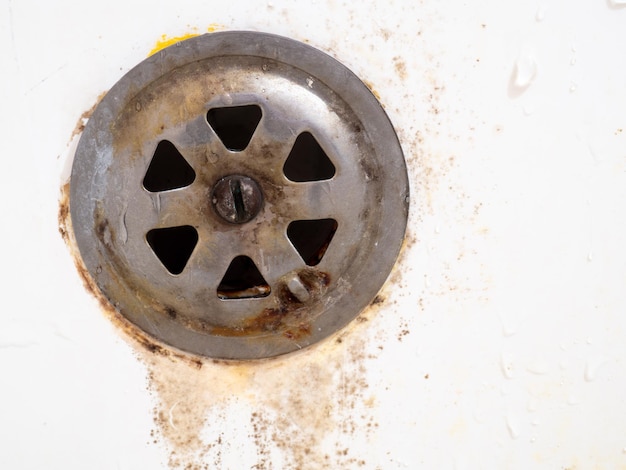 Rusty drain overflowing for the bathroom Mold on bathroom faucet Old plumbing Requires replacement