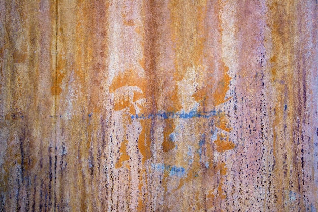 Rusty iron sheets with paint spots selective focus