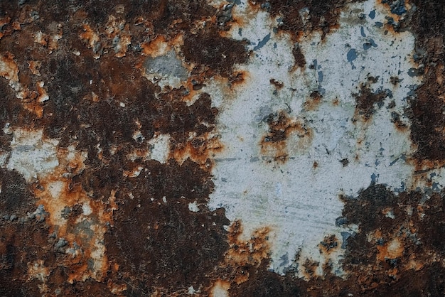 Rusty metal surface with blue paint residue as background image. Place for text or advertising