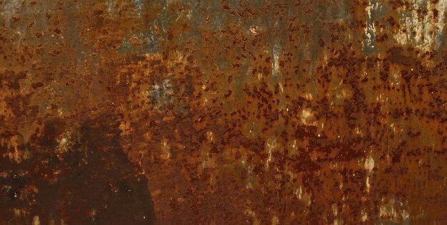 A rusty metal surface with a sign that says'the word'on it '