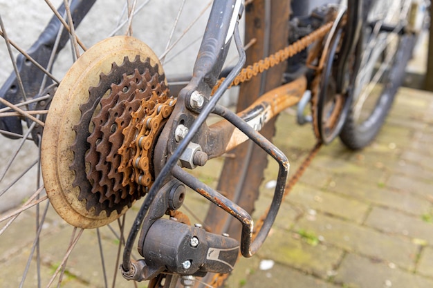 Rusty old bicycle chain on the speed gears of a bicycle