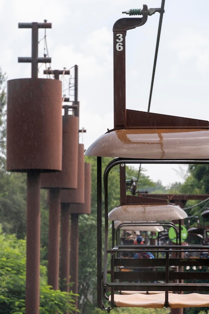 Rusty old cable car cable car ride in the rain views of the\
canyon vegetation and people mexico