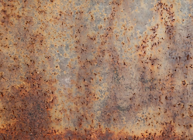 Rusty old metal plate with textured effect