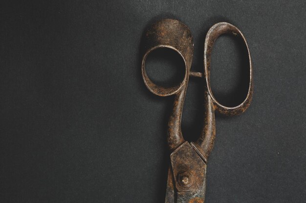 Rusty and old scissors on white background