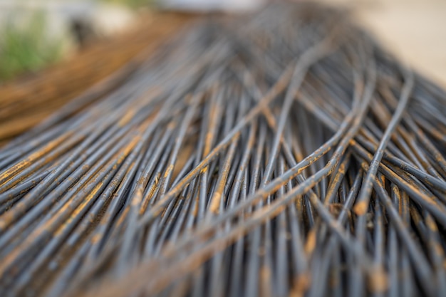 Rusty round steel bar on street