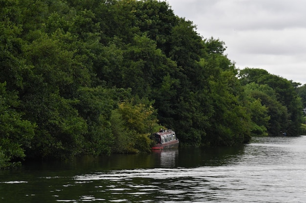 Rusty rugged ship in thames river