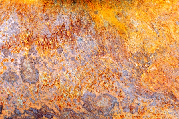 Rusty surface of a metal sheet close-up. Corrosion steel and iron texture background.