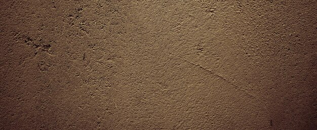 Foto ruw geschilderde betonnen muur. donkere ruwe korrelige steen of betonnen muur textuur achtergrond, grunge textuur. donker behang. schoolbord, schoolbord