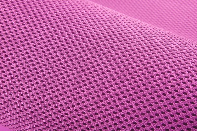 Foto ruwe roze stof textuur katoen gebreide stof moderne waterdichte flexibele temperatuurcontrole materialen multifunctionele slimme textiel close-up selectieve focus scheurt niet