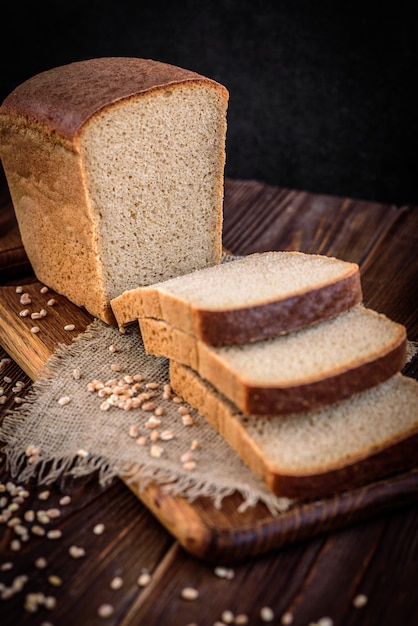 Rye bran bread on dark wooden table