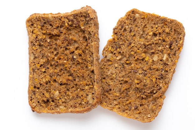 Rye bread slice on a white surface.  Flat lay.