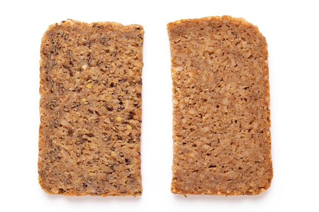 Rye bread slice on a white surface.  Flat lay.