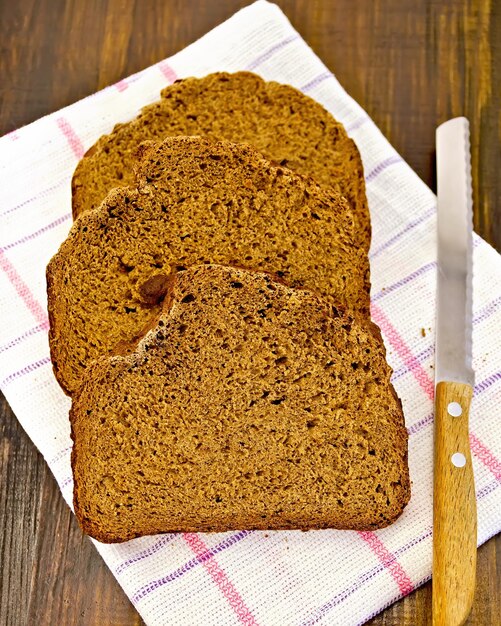 Rye bread slices with a knife on a napkin