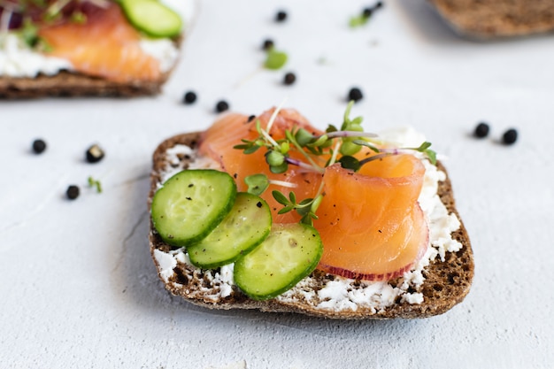 Rye bread, smoked salmon, cucumber and microgreens