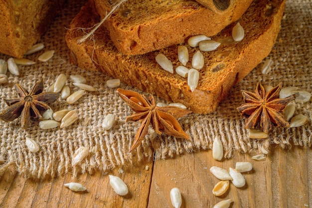 Rye bread next to the sticks of cinnamon and star anise