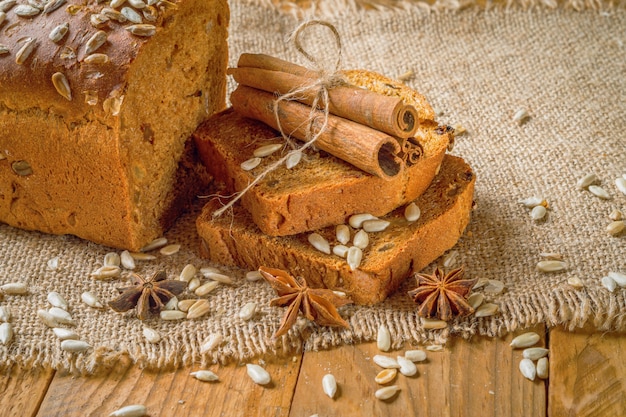 Rye bread next to the sticks of cinnamon and star anise